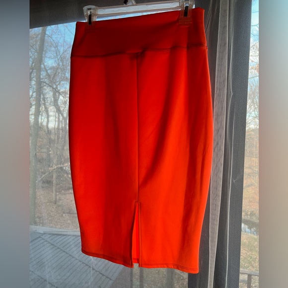 I’m in love with Derek hot orange pencil skit with opening in the back. Size L - Picture 3 of 6